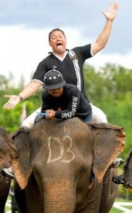 All Black Charles Riechelmann on elephant Charles Riechelmann rides an elephant